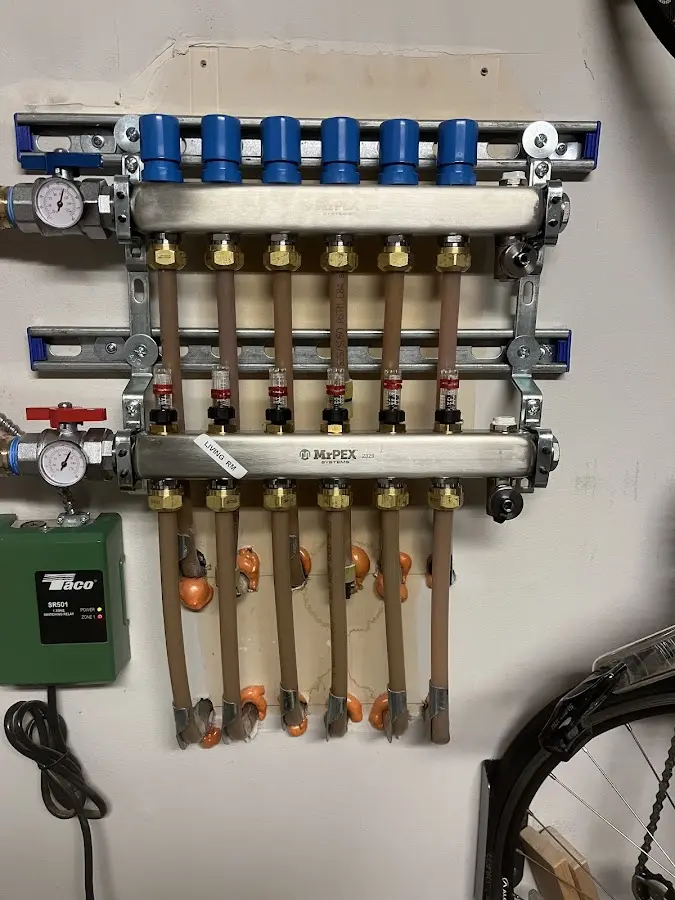 Plumber performing Gas Line Installation at a residential property in Estherville